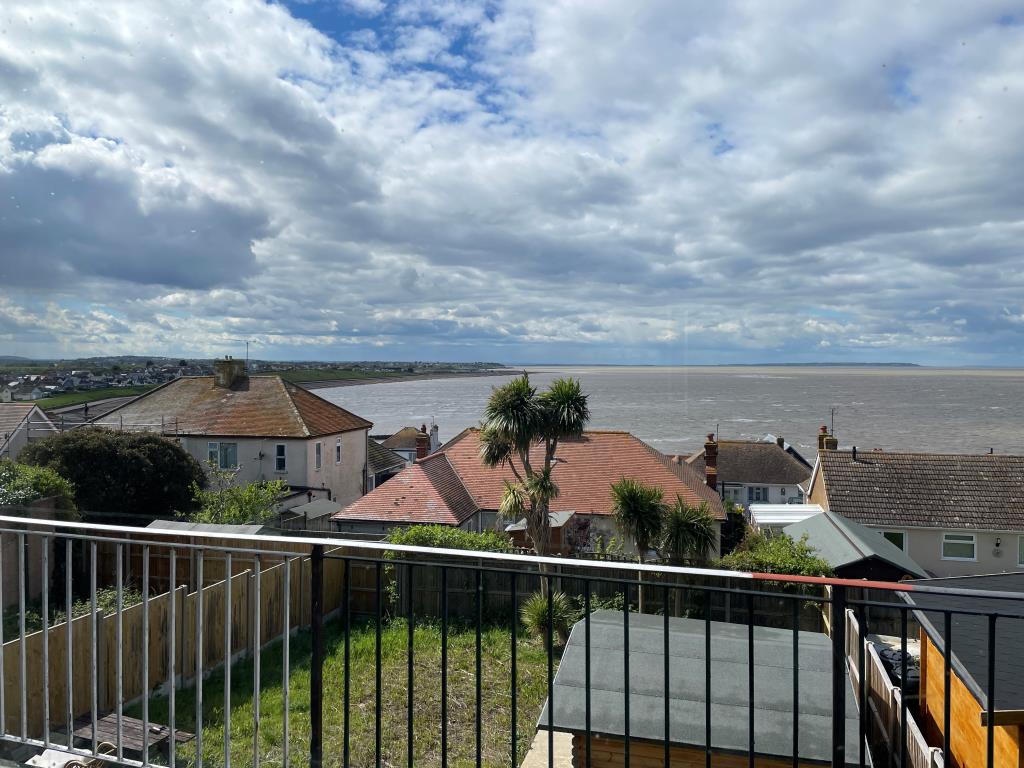 Lot: 124 - DETACHED FOUR-BEDROOM HOUSE WITH IMPRESSIVE SEA VIEWS - Sea view from rear balcony